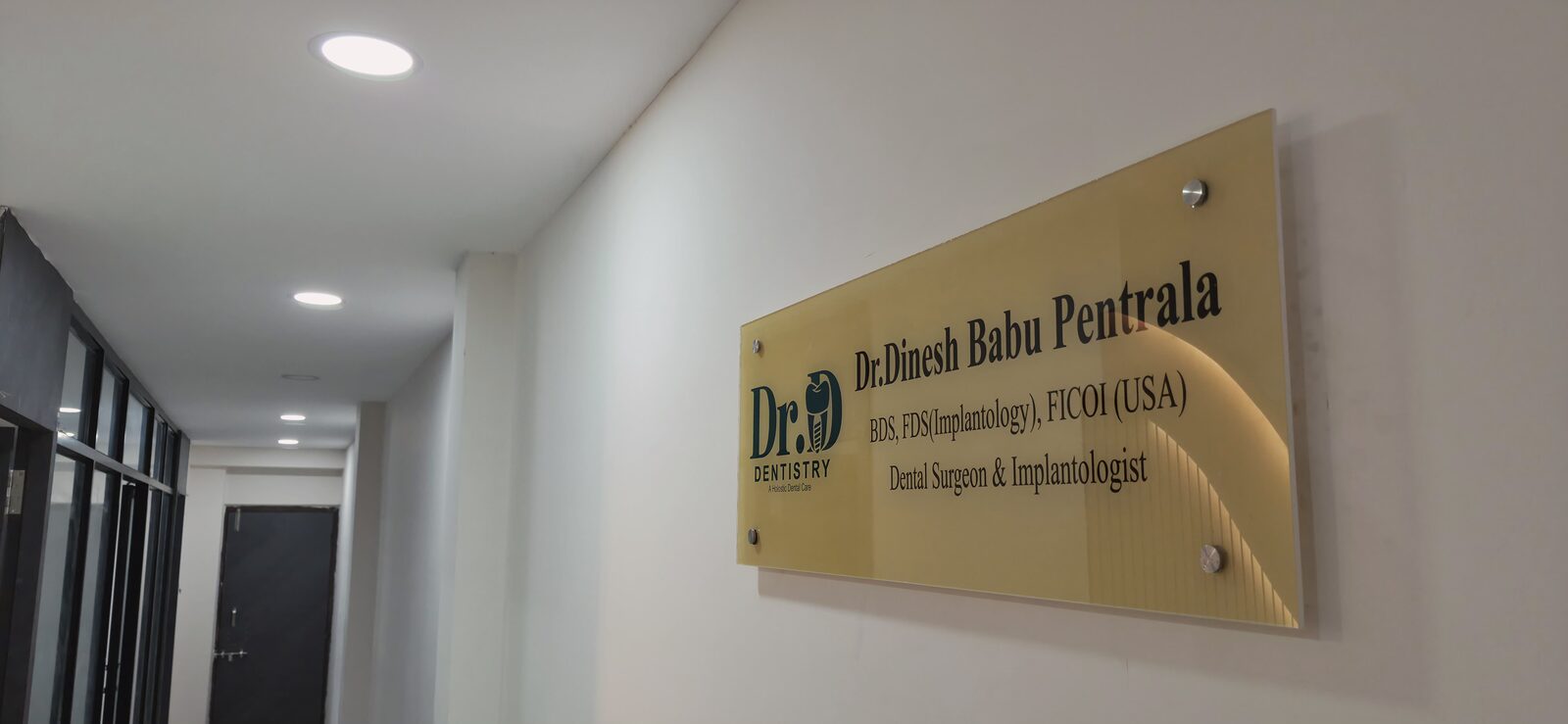 Dr. Dinesh Babu Pentrala name plate at the clinic entrance